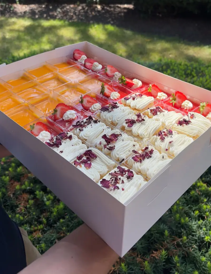 A box of mini dessert cups for a party